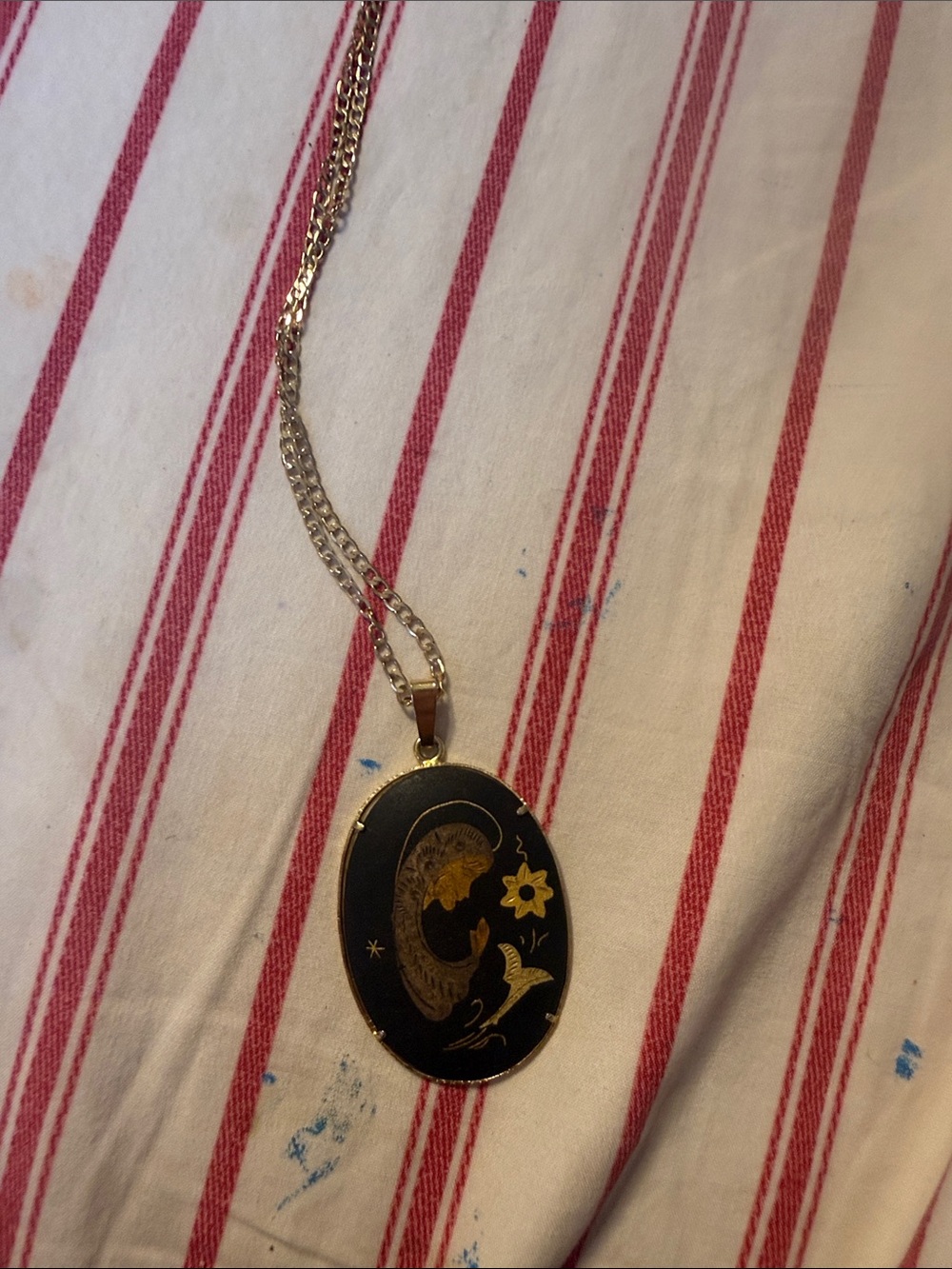 Gold-Tone Black Enamel Oval Pendant Necklace with Floral Motif
